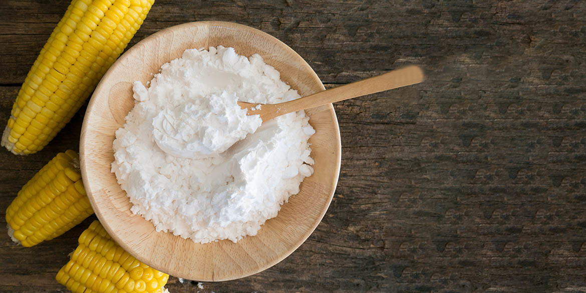 White Corn flour powder  in spoon wooden.