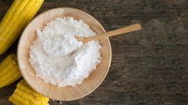 White Corn flour powder  in spoon wooden.