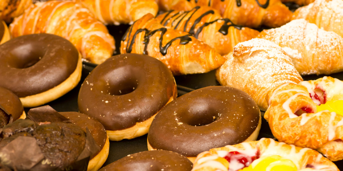 Close up of Donuts, Muffins, Croissants and Sweet Pastries
