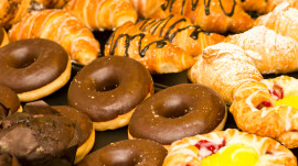 Close up of Donuts, Muffins, Croissants and Sweet Pastries